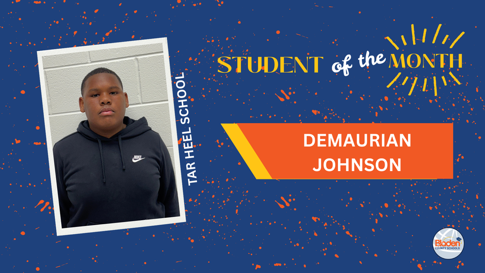 Portrait of Tar Heel School Student of the Month, Demaurian Johnson (DJ), standing against a light brick wall, wearing a black Nike hoodie, displayed on a blue Bladen County Schools recognition graphic.