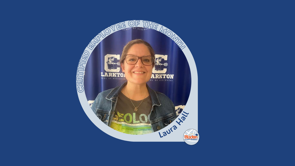 Graphic announcing Certified Employee of the Month featuring Laura Hall, smiling in front of a Clarkton School of Discovery backdrop, wearing glasses, a denim jacket, and a geology-themed shirt, with Bladen County Schools logo.