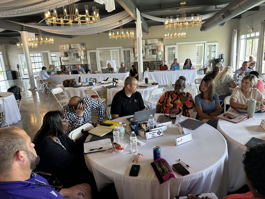 West Bladen High School team collaborating during a table discussion at the retreat.