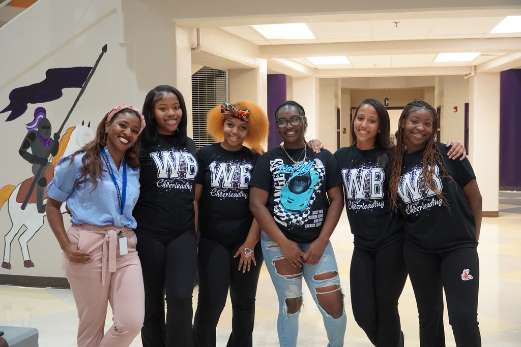 West Bladen cheerleaders pose with a staff member during orientation night.