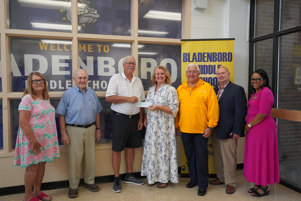Group photo at Bladenboro Middle as Rotary presents $1,000 check to school principal.