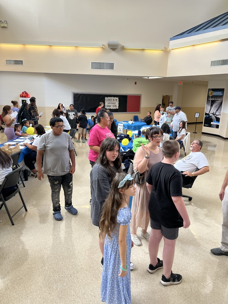 student and parents in an open area