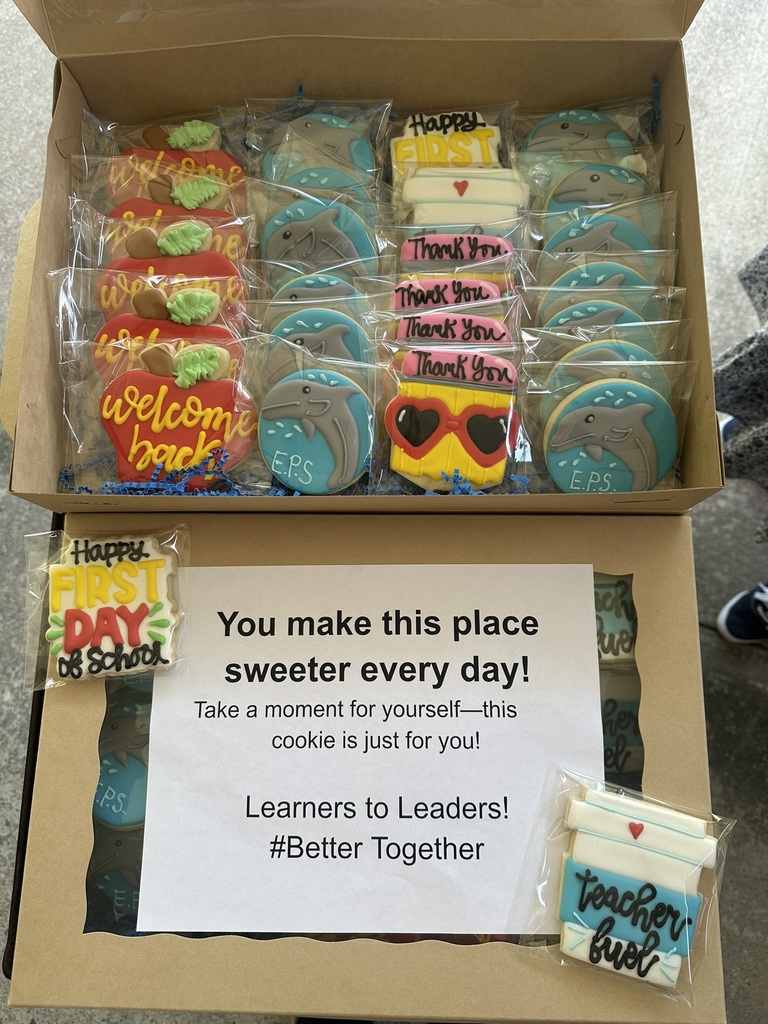 A box of decorated cookies with messages like “Welcome Back,” “Thank You,” and “Teacher Fuel,” along with a note of appreciation.