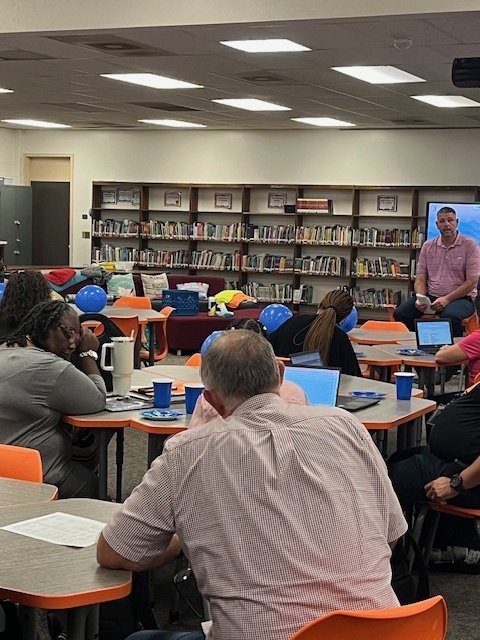 Blue balloons and confetti with text: ‘Today we celebrate with a BLUE party! Elizabethtown Middle School exceeded growth for 2024–2025.’