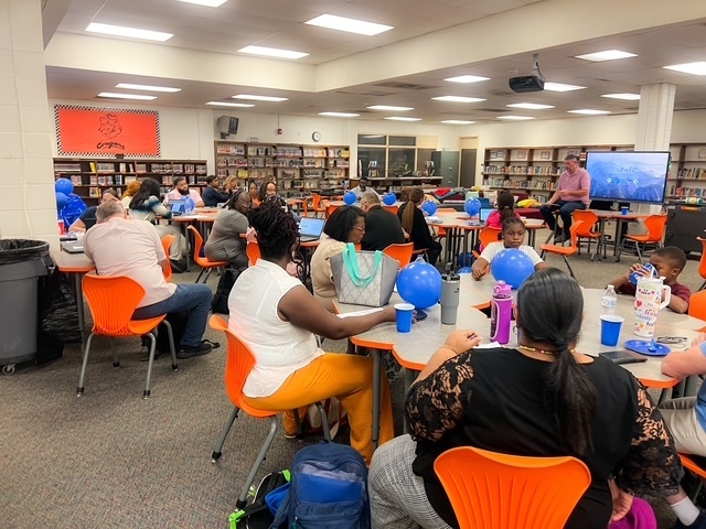 Blue balloons and confetti with text: ‘Today we celebrate with a BLUE party! Elizabethtown Middle School exceeded growth for 2024–2025.’