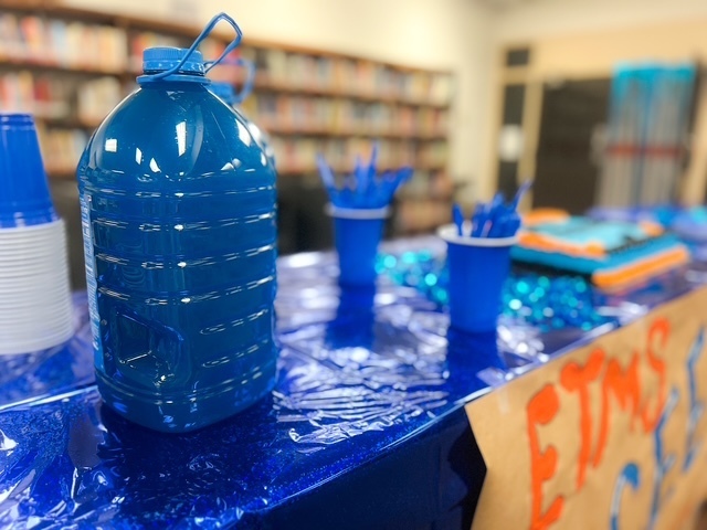 Blue balloons and confetti with text: ‘Today we celebrate with a BLUE party! Elizabethtown Middle School exceeded growth for 2024–2025.’