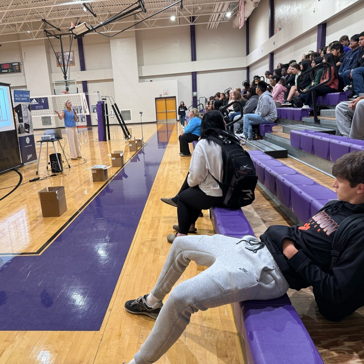 jostens representative speaking with senior class in the gym