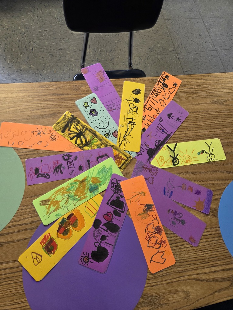 A collection of colorful bookmarks featuring various expressive faces, arranged together on a flat surface.