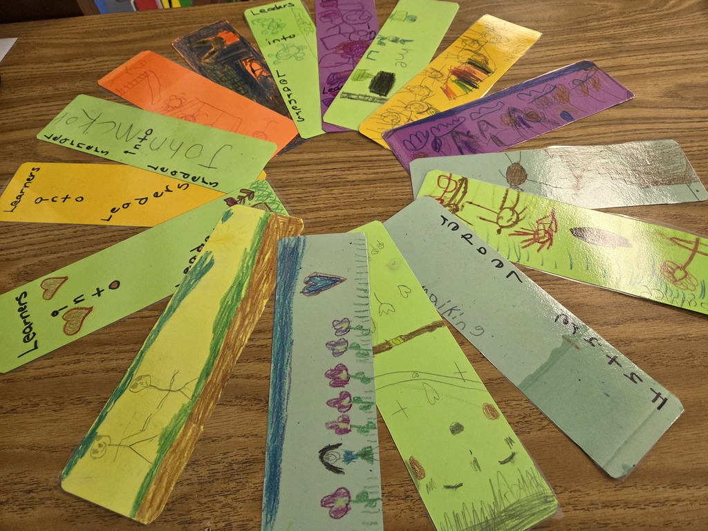 A collection of colorful bookmarks featuring various expressive faces, arranged together on a flat surface.