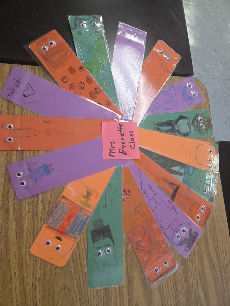 A collection of colorful bookmarks featuring various expressive faces, arranged together on a flat surface.