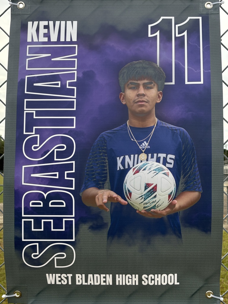 A soccer banner featuring a West Bladen player wearing a blue Knights jersey with the number 15. The banner includes the player’s name, “Gerson Verdugo Roblero,” displayed in bold white and purple letters on a stormy purple background with lightning accents. The player is giving two thumbs up and looking toward the camera.