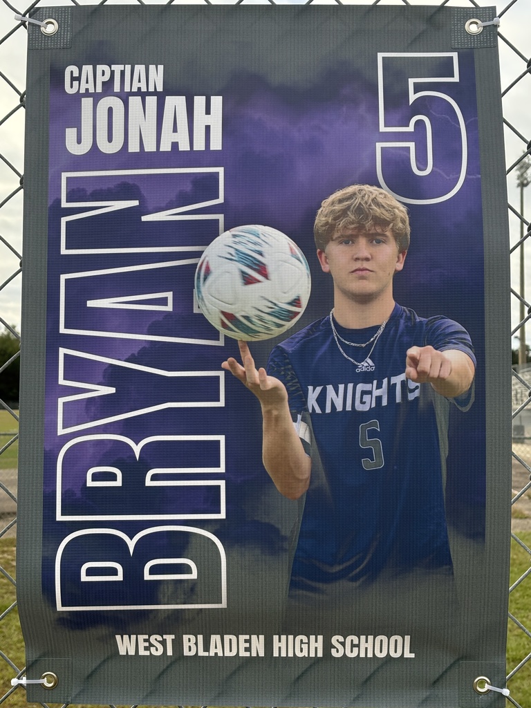 A soccer banner featuring a West Bladen player wearing a blue Knights jersey with the number 15. The banner includes the player’s name, “Gerson Verdugo Roblero,” displayed in bold white and purple letters on a stormy purple background with lightning accents. The player is giving two thumbs up and looking toward the camera.