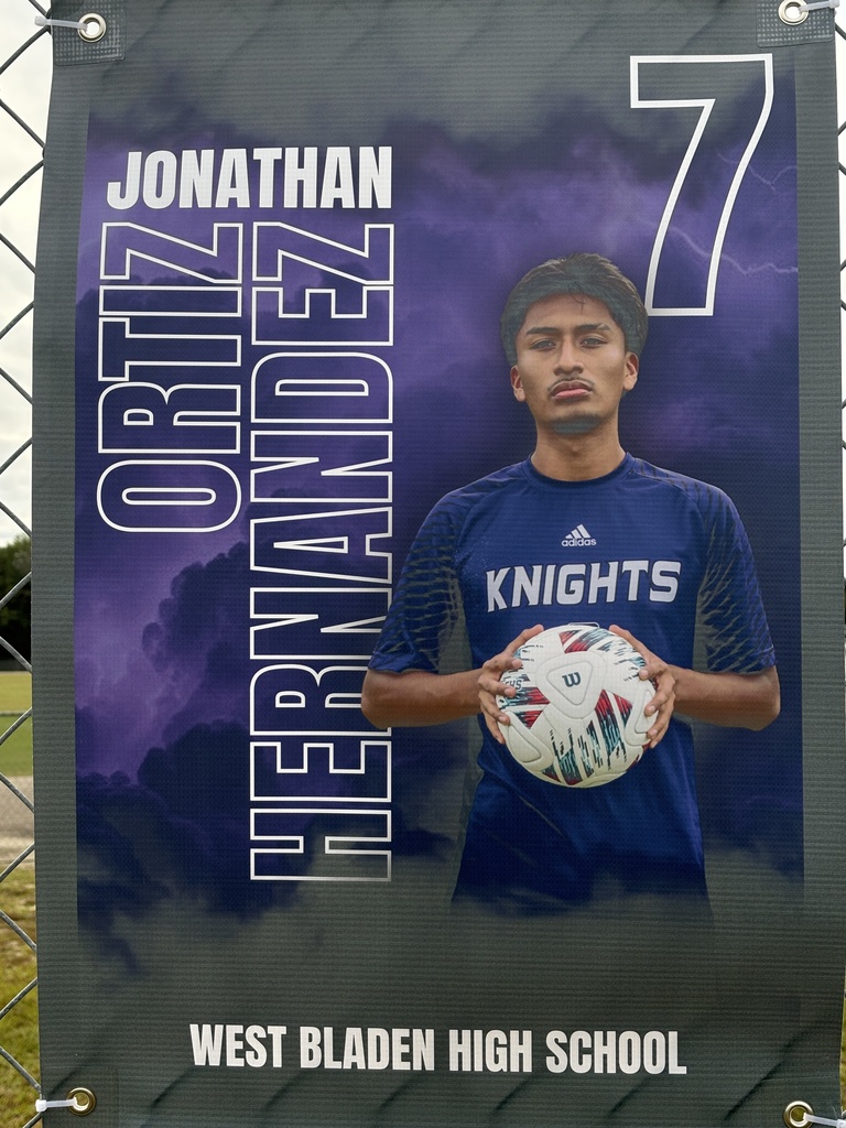 A soccer banner featuring a West Bladen player wearing a blue Knights jersey with the number 15. The banner includes the player’s name, “Gerson Verdugo Roblero,” displayed in bold white and purple letters on a stormy purple background with lightning accents. The player is giving two thumbs up and looking toward the camera.