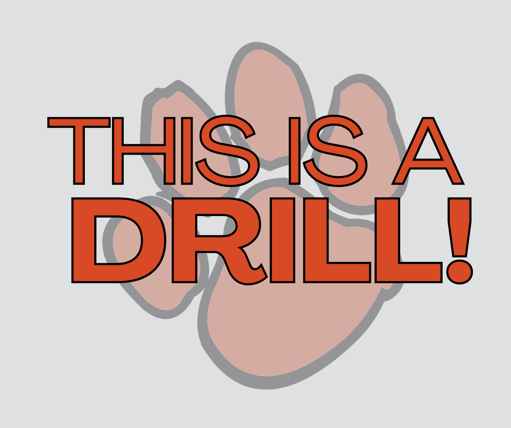 Graphic with an orange paw print in the background. Text over the image reads ‘THIS IS A DRILL!’ in bold orange and black outlined letters.
