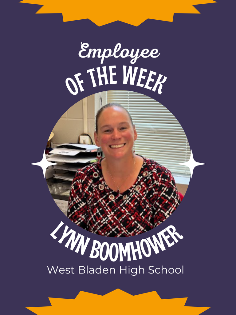 Graphic featuring Lynn Boomhower, West Bladen High School’s Employee of the Week. She is smiling while seated at her desk, wearing a red, black, and white patterned top. The design includes purple and gold accents with white text that reads “Employee of the Week – Lynn Boomhower – West Bladen High School.
