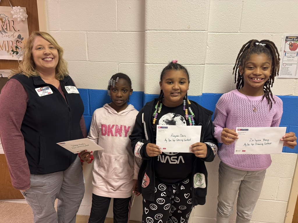 Group of students posing together after being recognized as winners of the Coloring and Drawing Contest for Ag Em Up Day.