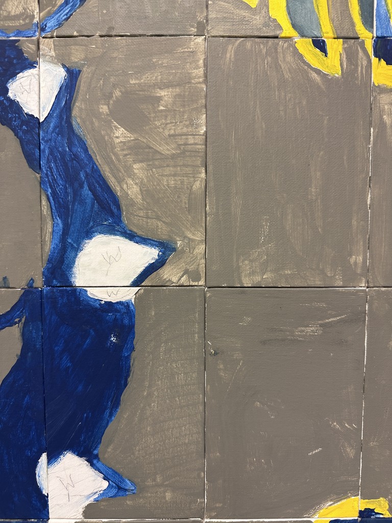 Abstract blue form with white areas on gray painted tiles, part of a larger bulldog mural made from multiple squares.