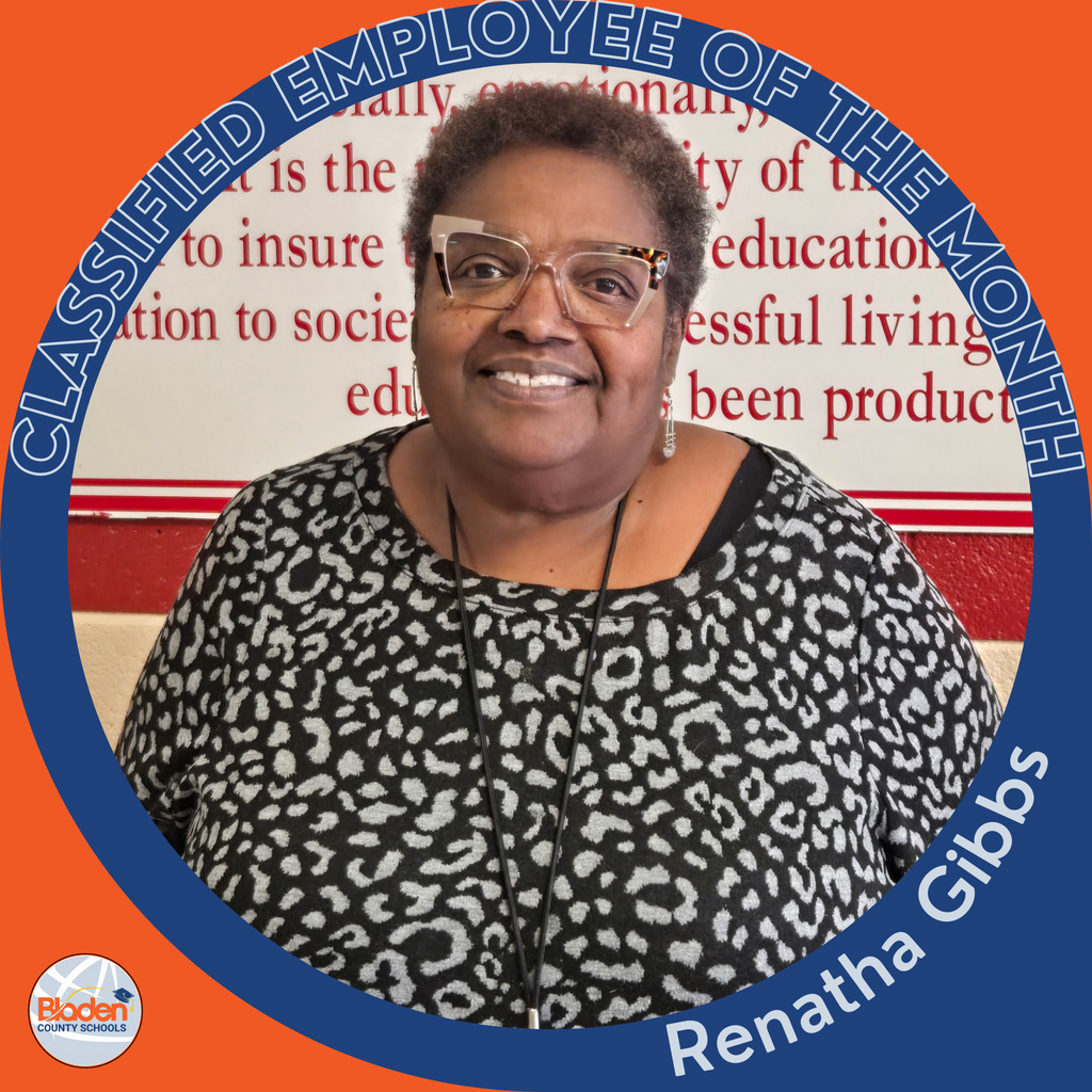 Circular ‘Classified Employee of the Month’ graphic featuring a woman smiling in front of a wall with printed text. She is wearing patterned clothing and glasses. Text on the graphic reads ‘Renatha Gibbs.