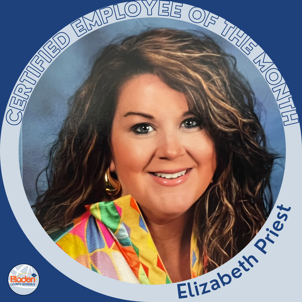 Circular ‘Certified Employee of the Month’ graphic featuring a woman smiling in front of a blue studio background. She has curly brown hair with highlights and is wearing a colorful patterned top. Text on the graphic reads ‘Elizabeth Priest.