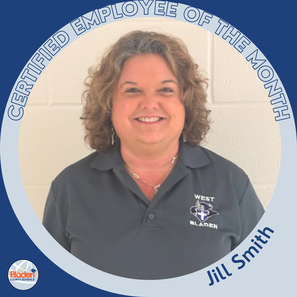A woman with curly hair wearing a navy polo shirt with the West Bladen logo stands against a light-colored wall, smiling. The circular frame reads ‘Certified Employee of the Month – Jill Smith.