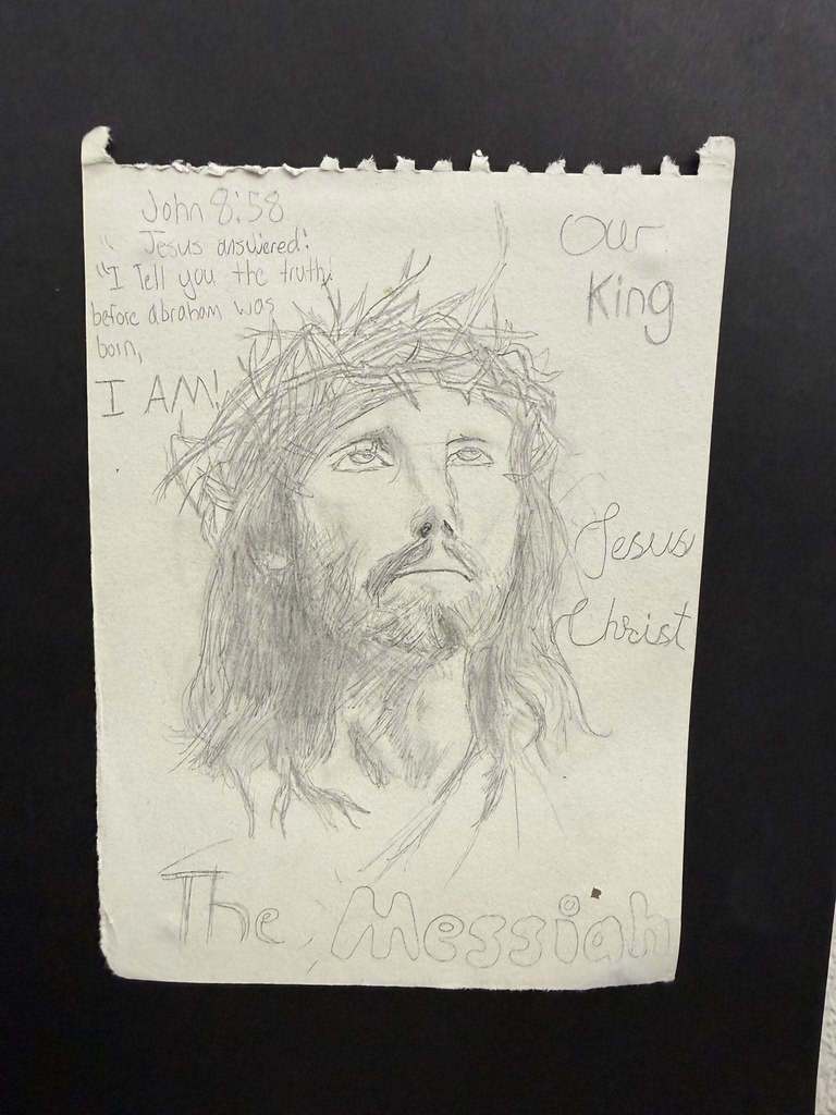 Pencil drawing of Jesus wearing a crown of thorns with handwritten scripture reference John 8:58 and the words “The Messiah.”