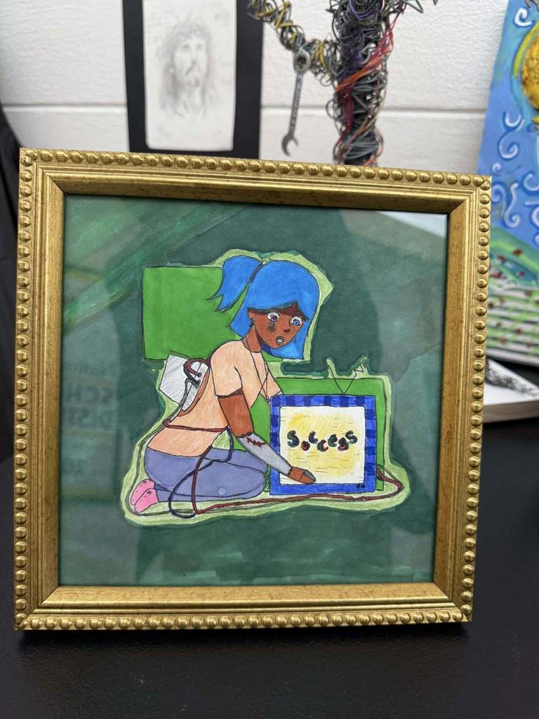 Framed illustration of a blue-haired girl connected by wires to a television screen displaying the word “Success.”