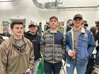 4 smiling male students at FFA