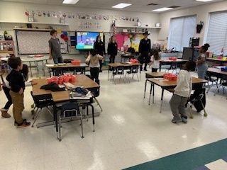 FFA students talking to a classroom of elementary students