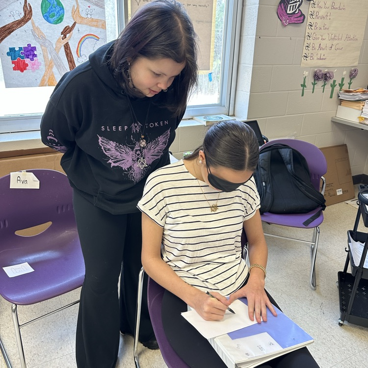 two students participate in an activity