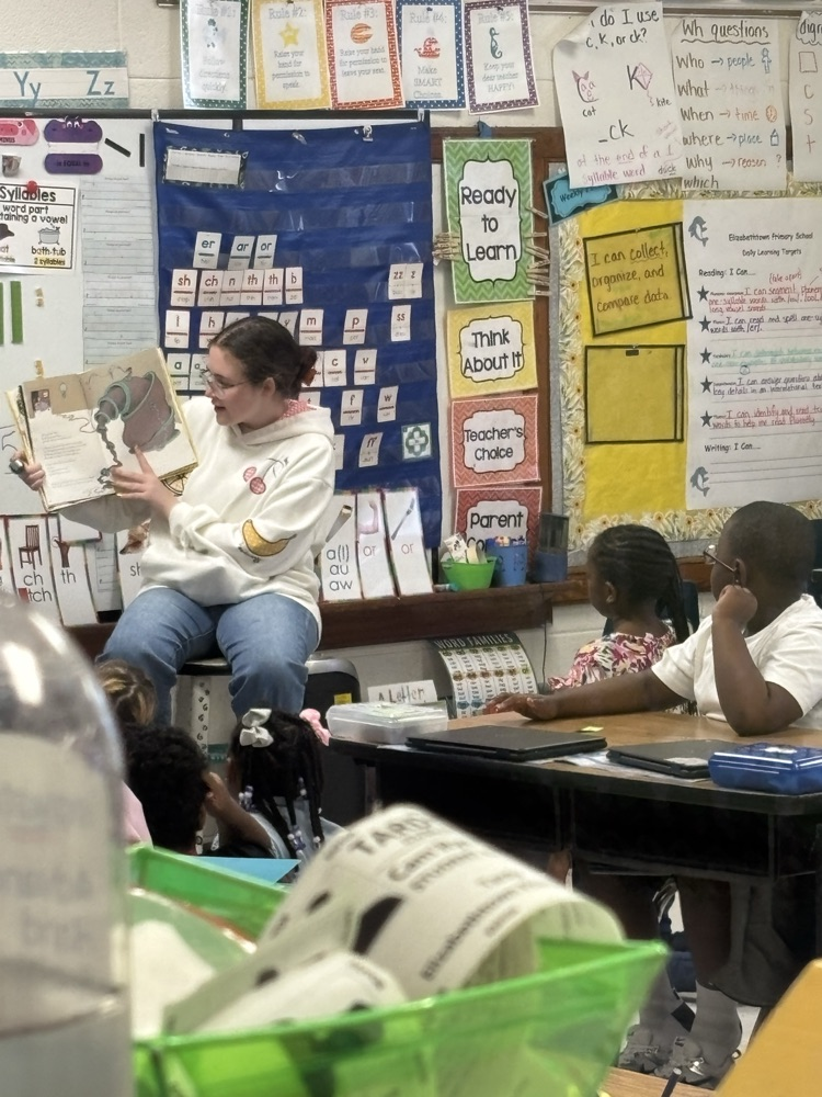 student sitting at their desk ETP A East Bladen student sits on a stool reading a story in a white sweatshirt