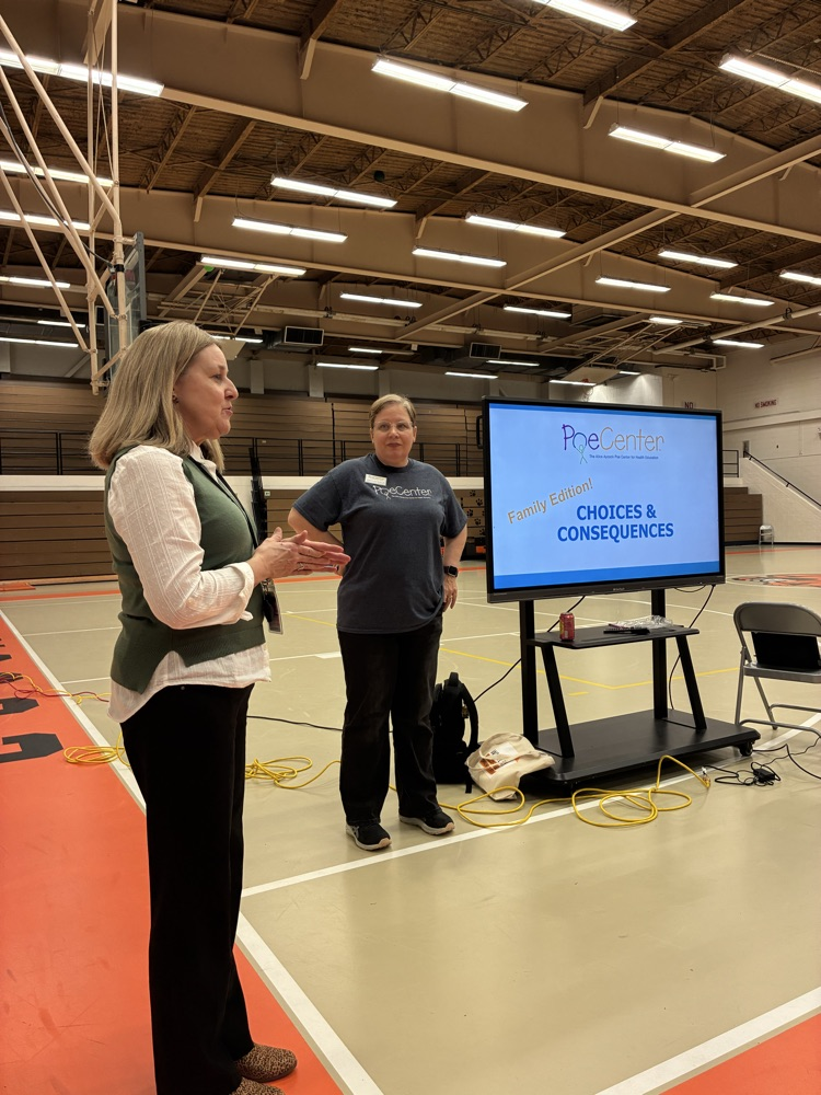 two ladies standing in front of a Cleartouch