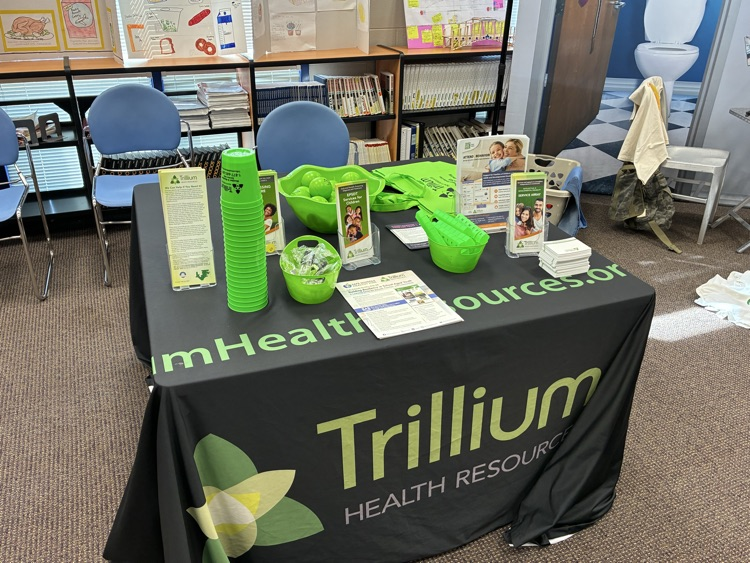 black and green table cloth showing Trillium resources in a library