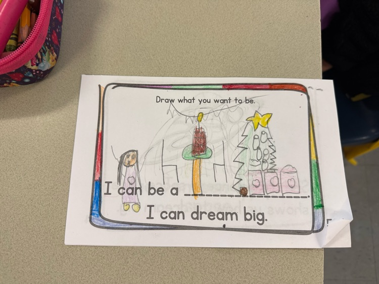 Student drawing showing a dream to be a chef with a decorated cake and Christmas tree.