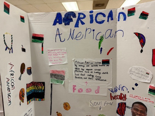 Tri-fold presentation board about African American culture featuring cultural symbols, traditional foods, and notable figures.