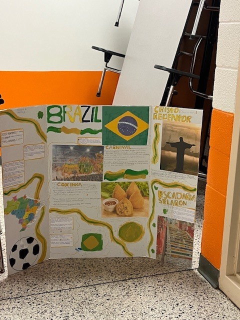 Student display board about Brazil featuring the Brazilian flag, Carnival, Christ the Redeemer, food, maps, and cultural facts.