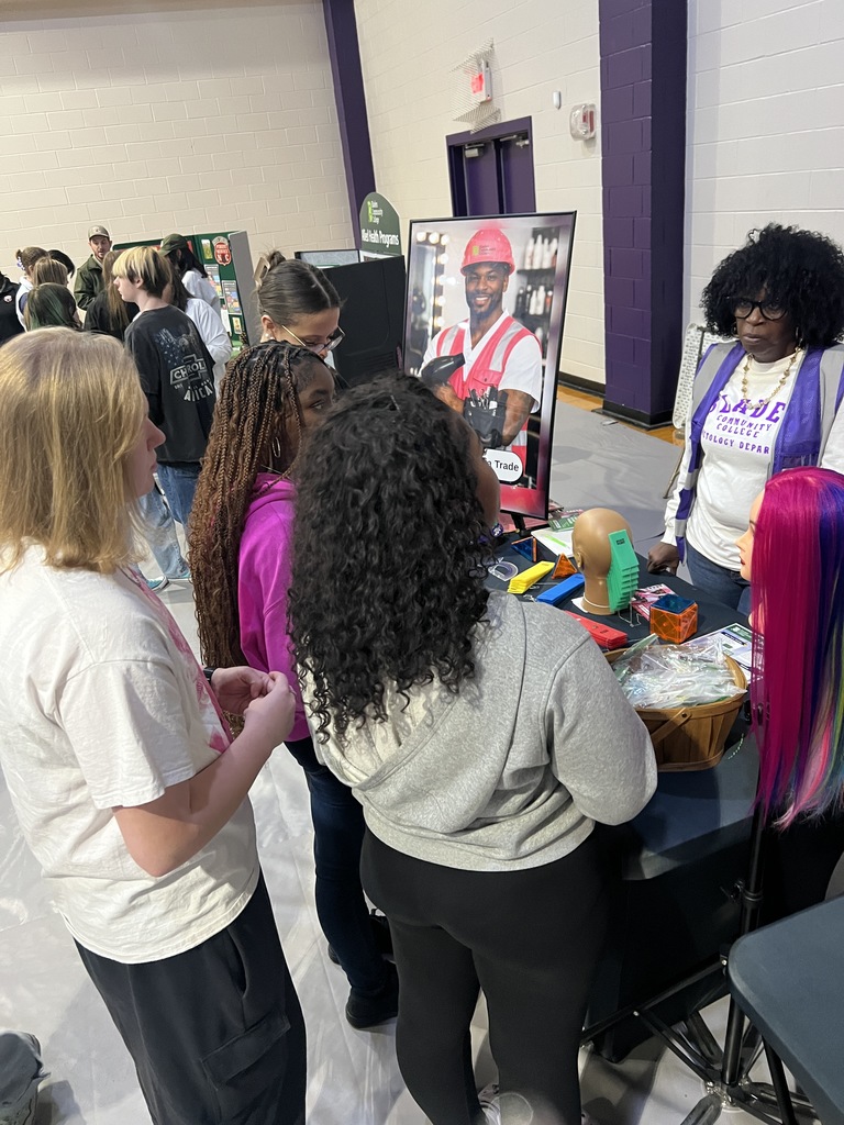 Students and a community partner discuss career paths at the West Bladen CTE Annual Career Fair