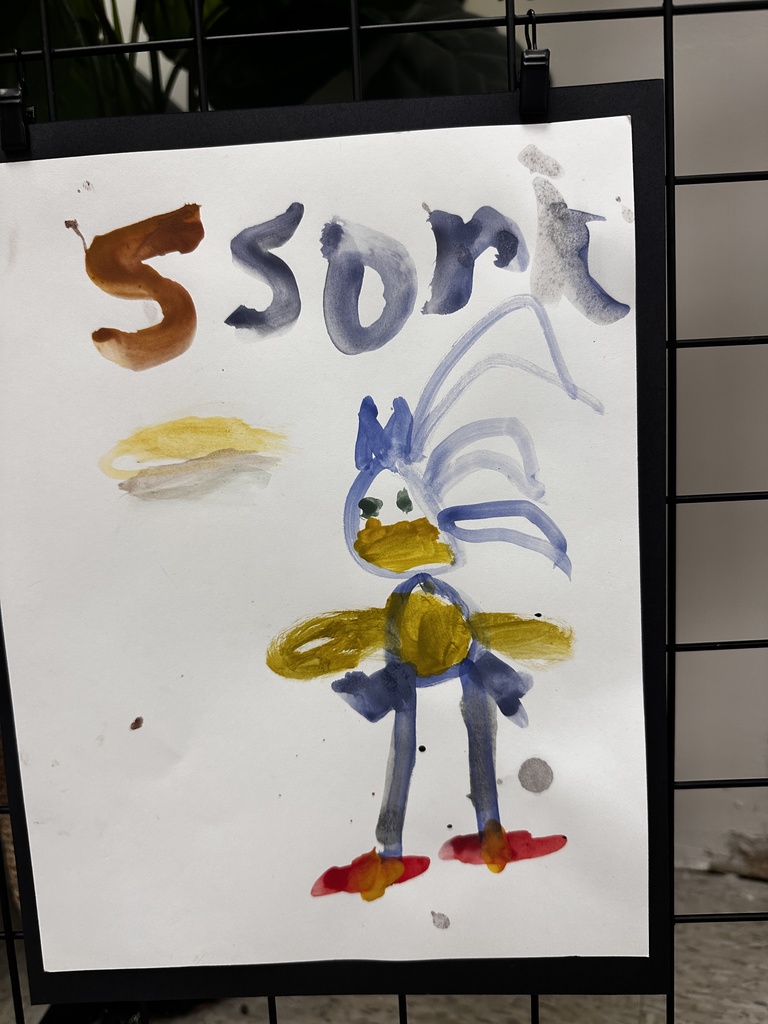Child's watercolor painting of Sonic the Hedgehog with painted text reading "Ssonic"