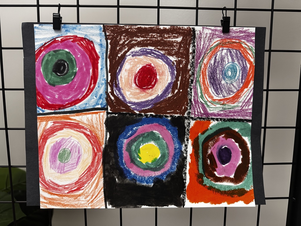 Child's oil pastel artwork of six concentric circle designs in a grid, inspired by Kandinsky