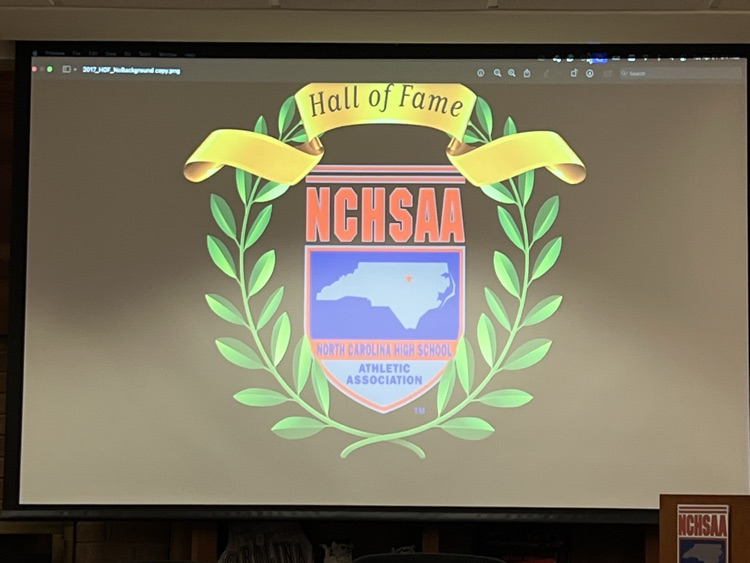 NCHSAA LOGO WITH BLACK BACKGROUND AND GOLD BANNER ACROSS THE TOP THAT READS HALL OF FAME