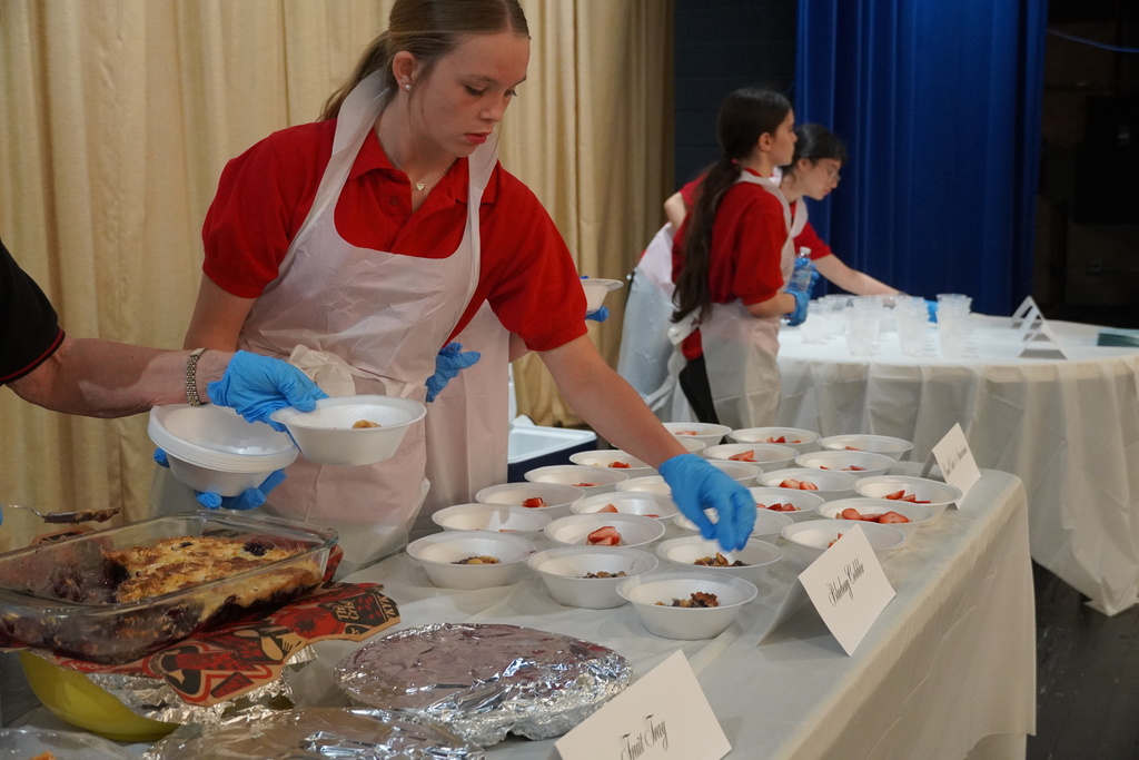 High school Foods Science students are preparing lunch.