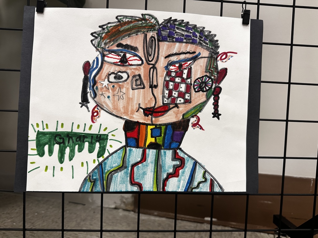 Stylized portrait drawing of a person's head and upper torso with split design: left side features an open eye with red iris and brown-green hair; right side has a closed eye with checkered purple and black hair pattern and red-white checkered cheek. The figure has a colorful blocky neck with red, blue, yellow, green, and purple squares and a light blue striped torso. The bottom left corner contains a green dripping shape with the word "GNARLY" inside.