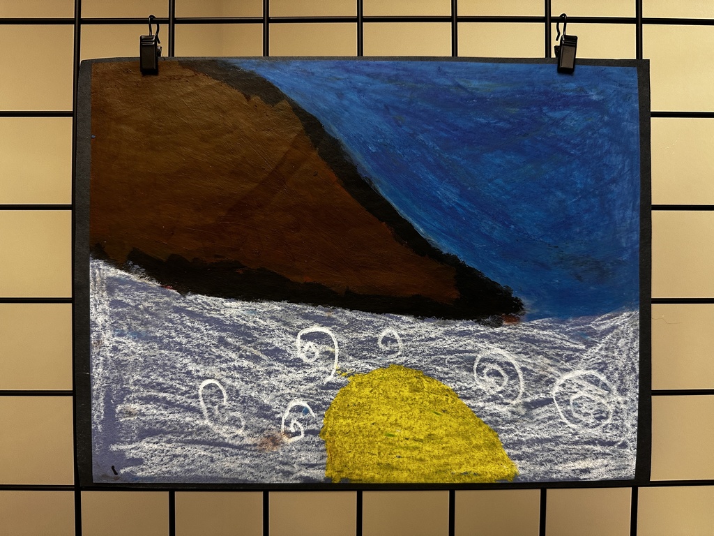  Child's crayon drawing on dark paper showing a seascape with a large brown landmass or ship hull in the upper left, textured blue sky or water in the upper right, and turbulent purple-blue water below with white wave spirals and a yellow rounded shape, possibly an island, in the center bottom.