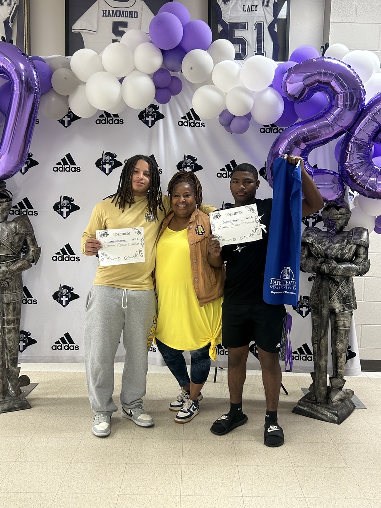 Three people pose together in front of the Decision Day backdrop, with two students holding “I Decided!” certificates. One student also holds a Fayetteville State University item, celebrating their next steps after graduation.