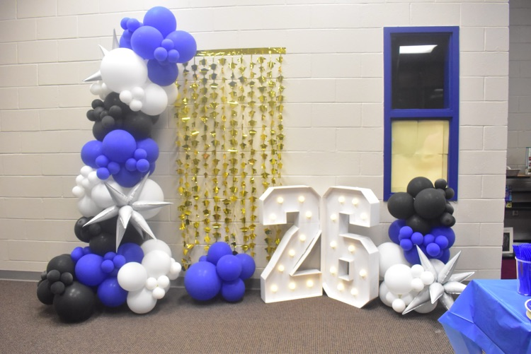 blue, black, white balloons with gold streamers and the number 26