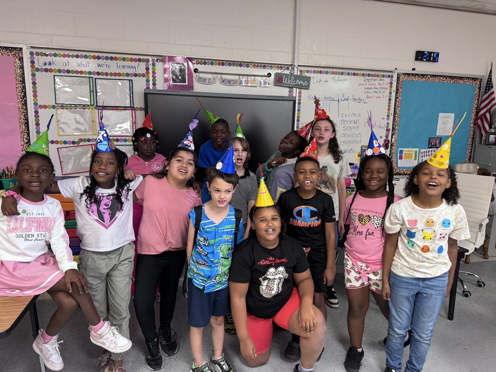 A group of students in Ms. Hill’s classroom wear colorful handmade “thinking caps” to help ease EOG testing anxiety.