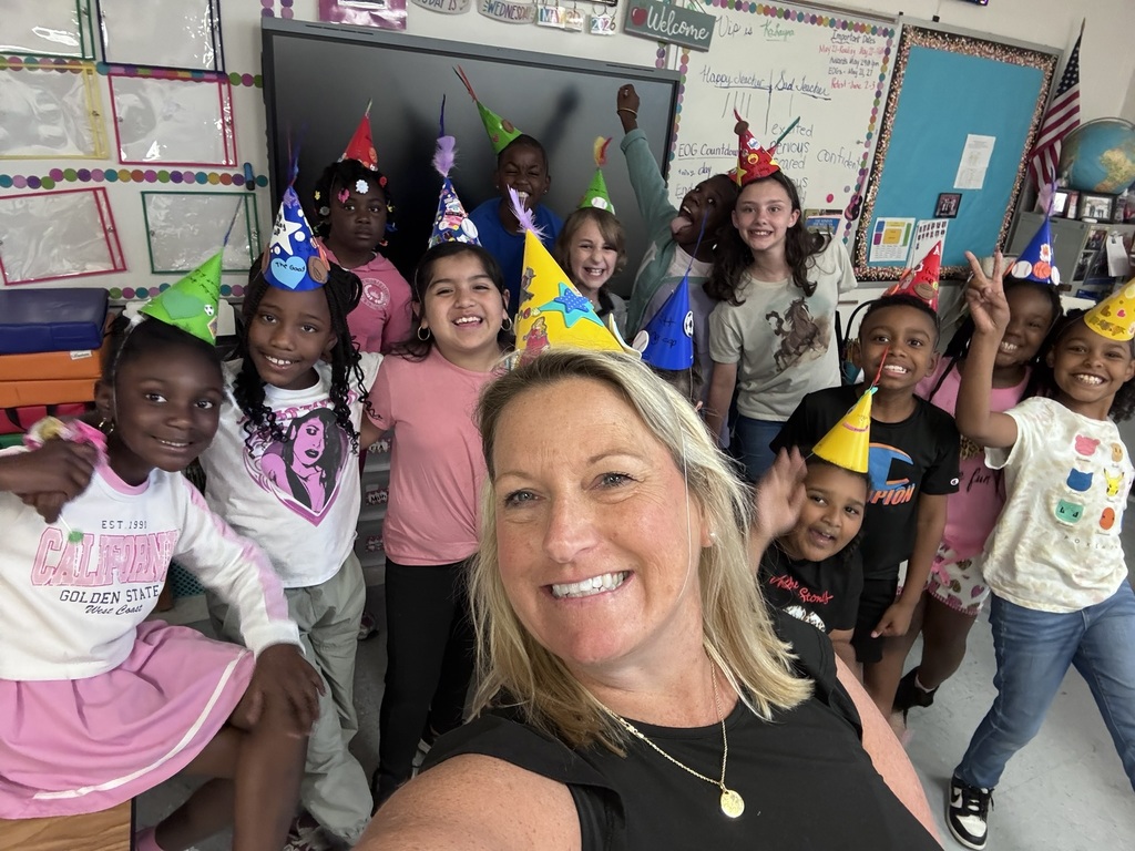 A group of students in Ms. Hill’s classroom wear colorful handmade “thinking caps” to help ease EOG testing anxiety.