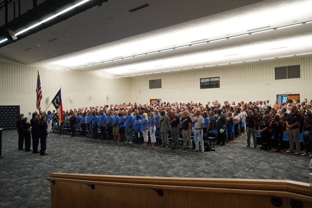 WBHS JROTC present colors in the auditorium with all bladen county school staff.