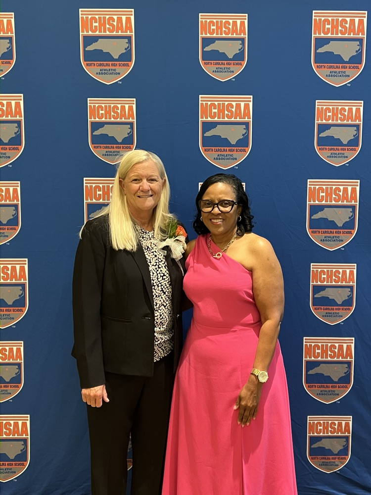 Coach Evers and Deputy Superintendent Ann Brown .