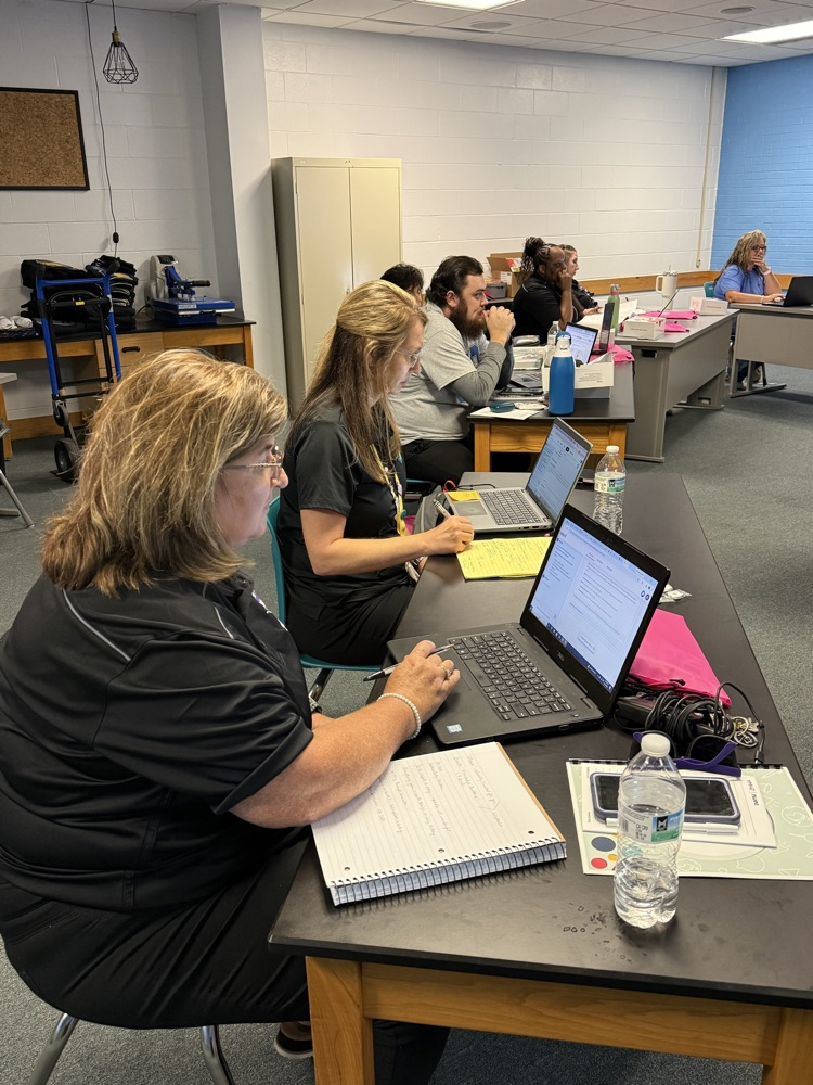 High School educators participate in curriculum training.