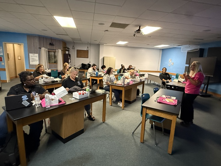 High School educators participate in curriculum training.
